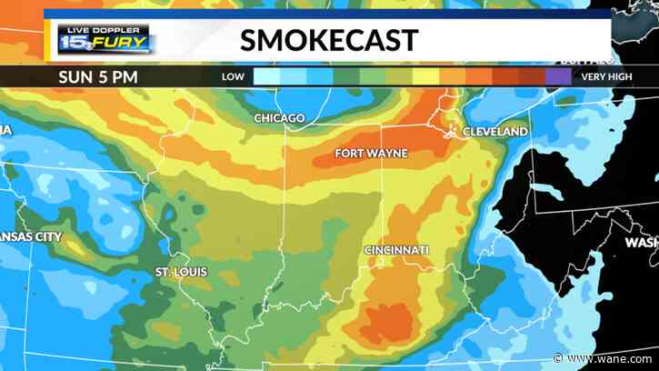Hazy and breezy Sunday with a slight rain chance