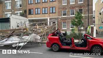 Woman hurt in Hackney as wind blows scaffolding on car