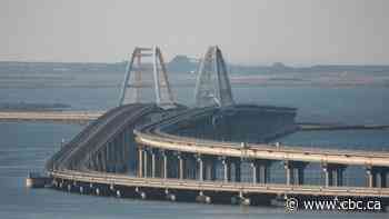 Blasts on Crimea bridge kill 2, threaten Russian war supply lines