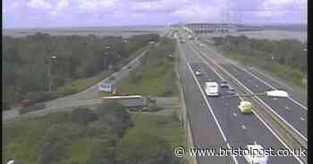 Two women die in M4 crash as three men are arrested