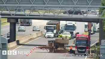 M6 shut as lorry carrying machinery hits bridge