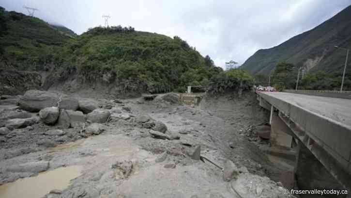 A mudslide in Colombia kills at least 14 people and blocks a crucial highway
