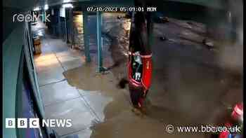 Watch a parking lot fill with water in seconds in flash flood