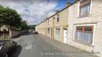 Drugs, a gun and £30,000 in cash found in Burnley house