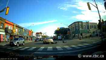 Video captures cyclist struck, dragged into intersection in north Toronto