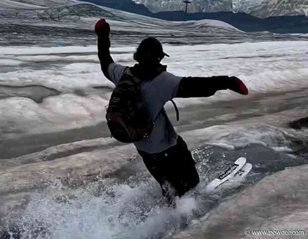Skiers Ride Melting Glacier In The Summer Sun