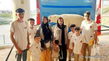 'We found our home again,' Afghan man says after family arrives on charter flight to Manitoba
