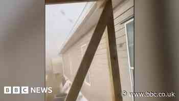 Video captures moment tornado rips off a roof