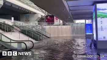 Waterfalls form at train station after heavy rains