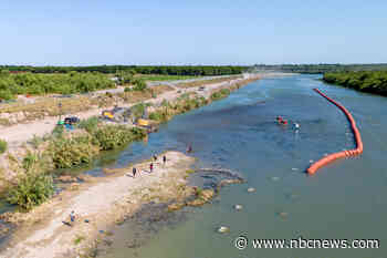 Justice Department threatens to sue Texas over migrant buoys