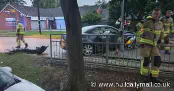 Hull driver smashes into parked car with such force it mounts pavement and hits shed