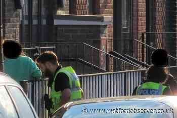 Armed police in Whippendell Road after property attacked