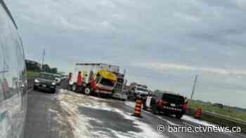 An early morning crash between a transport and road sweeper on Highway 400 slowed traffic