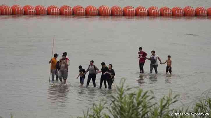 Biden administration sues Texas governor over Rio Grande buoy barrier that’s meant to stop migrants
