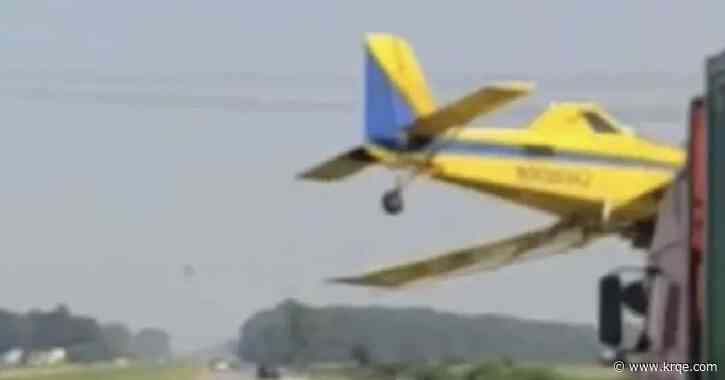 WATCH: Crop dusting plane nearly clips semi-truck in Indiana