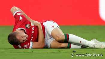 Manchester United 1-3 Wrexham: League Two side earn win but talisman Paul Mullin suffers punctured lung