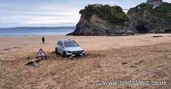 Driver gets Mercedes SUV stuck in sand after mistaking beach for free parking