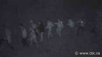 A mysterious cellphone, cryptic instructions and an interrupted smuggling run of 14 Indian nationals