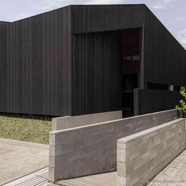 "Boxy and mysterious" villa nestles into forested valley in Indonesia