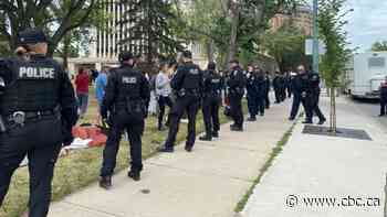 Regina police make arrests as officers move in to clear city hall homeless encampment