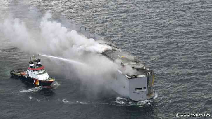 Burning cargo ship off Dutch coast will be towed to a new location after flames and smoke subsided