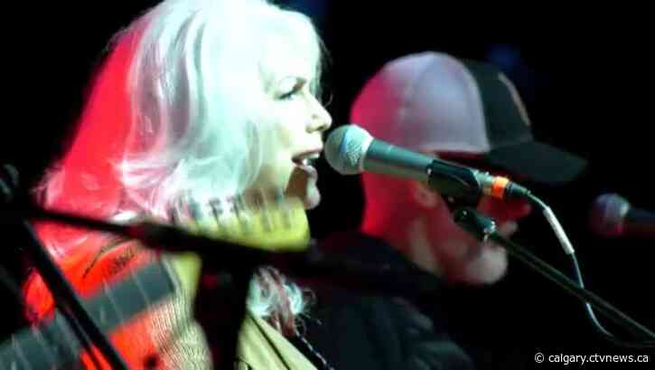 Folkies shrug off rain to celebrate musical legends in Prince's Island Park