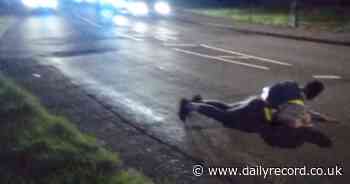 Eco-activists 'concrete' themselves on road to Scots oil terminal in latest protest