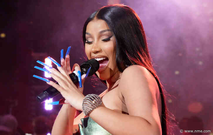 Cardi B throws microphone at audience member who chucked drink at her on stage