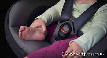 When can my child sit in a car front seat with a booster?