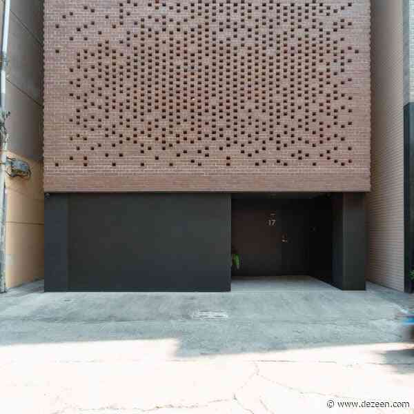 Paperfarm conceals home in Taiwan behind perforated "brick veil"