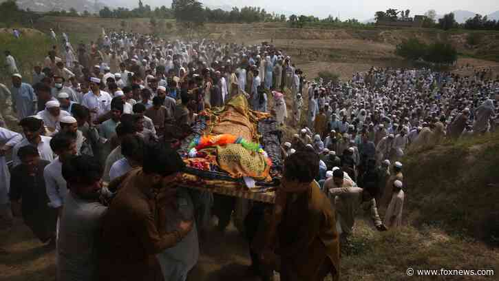 Mourners gather for funerals in Pakistan after deadly suicide bombing at election rally where 54 were killed