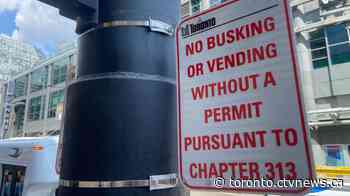 Toronto installs signs at Yonge-Dundas square warning of no unpermitted busking