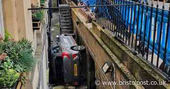 Drunk driver's car wedged into railings after crash outside historic West Country hotel