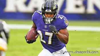 Ravens' John Harbaugh unsure of J.K. Dobbins' status amid injury, contract issues at training camp