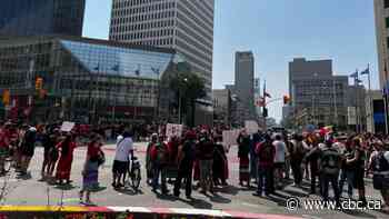 Hundreds rally in downtown Winnipeg to demand search of landfill for women's remains