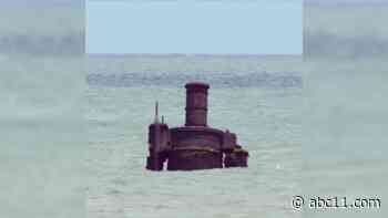Robot in the ocean?: Part of 1861 steamer boat seen sticking out of water in Cape Hatteras