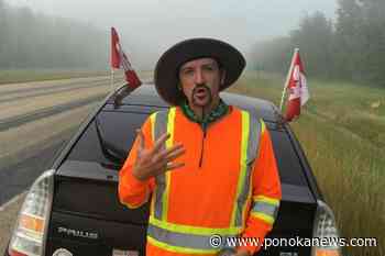 Walkers carrying ball and chains for mental health awareness to stop in Ponoka