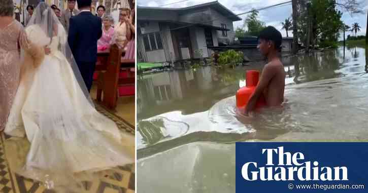 Bride wades through floodwaters after Philippines hit by typhoons – video report