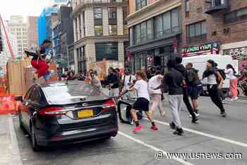 Crowd in the Thousands Overwhelms New York City's Union Square, Tosses Chairs, Climbs on Vehicles