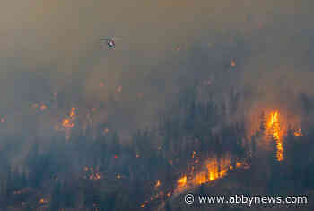 Wildfire north of Chase shows minimal growth as crews continue to battle blaze