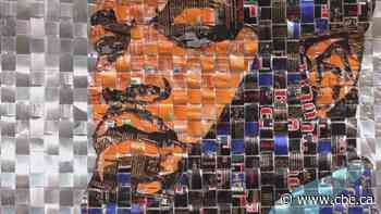 Warhol painted soup cans. This artist takes it a step further and turns soda cans into art