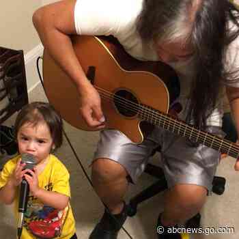 WATCH:  Toddler sings along with grandpa as he plays guitar