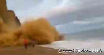 Shocking video shows beach-goers narrowly avoiding massive rockfall
