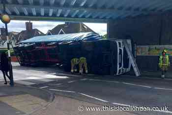 Lorry overturns after bridge crash near Fairlop Tube station