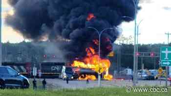 Flames, black smoke fill sky after fuel truck, train collide northwest of Edmonton