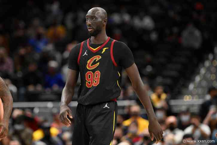 Professional basketball player Tacko Fall hands out new book to hundreds at Austin mosque