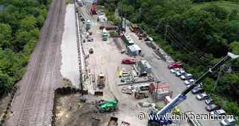 Suburban Skyview: Adding a third railroad line in Geneva