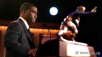 A USC football star gave up the Heisman trophy after controversy. His fellow alum is still mad about it