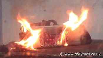 Watch the terrifying moment an e-bike battery EXPLODES - releasing plumes of toxic white smoke, sparks and flames