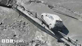 Italy floods: Torrent of muddy floodwater bursts through alpine town